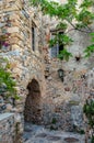 Byzantine Street with Traditional Alley with Arch in Monemvasia Island, Greece. Medieval Style Stone House with Big Windows Royalty Free Stock Photo