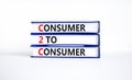 C2C consumer to consumer symbol. Concept words C2C consumer to consumer on books on a beautiful white table white background. Royalty Free Stock Photo