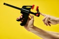 C-clamp in male hands, used for carpentry and welding Royalty Free Stock Photo