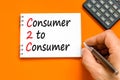 C2C consumer to consumer symbol. Concept words C2C consumer to consumer on white note on a beautiful orange background. Royalty Free Stock Photo