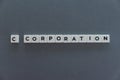 C corporation word made of square letter word on grey background