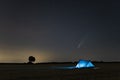 C / 2020 F3 comet NEOWISE in the evening sky. Camping under the starry sky, where there is a bright comet and a tail between t Royalty Free Stock Photo