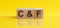 C F Cost With Freight, business - finance conceptual. Yellow background
