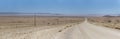 C13 gravel road and colorful flatland in Naukluft desert, north of Aus, Namibia