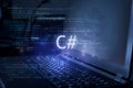 C# inscription against laptop and code background. Learn c sharp programming language, computer courses, training Royalty Free Stock Photo