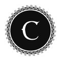 C letter in circle frame in floral ornament style on black color and white background