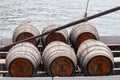 C.N. Kopke Porto wine barrels on a boat on the Douro river. Wooden cask, water background. Brown Keg Royalty Free Stock Photo