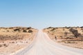 C17-road in southern Kalahari in Namibia crosses overgrown sanddunes Royalty Free Stock Photo