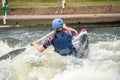 C1W class GB Canoe Slalom Athlete in white water action paddling away from camera Royalty Free Stock Photo