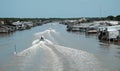 Ca Mau riverside residential with motor boat