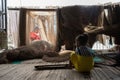 Ca Mau, Vietnam - Dec 6, 2016: Fisher family with the daughter playing near her mother mending casting net in Ngoc Hien, Ca Mau di Royalty Free Stock Photo