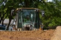 Cab of a bulldozer appears above the sand pile Royalty Free Stock Photo