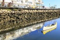 Yellow canoe anchored on calm blue water