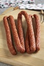 Cabanossi sausages close up for a snack on a cutting board Royalty Free Stock Photo