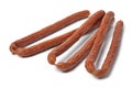 Cabanossi sausages close up for a snack on white background Royalty Free Stock Photo