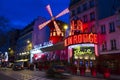 The cabaret Moulin Rouge in evening, Paris, France.