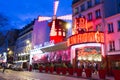 The cabaret Moulin Rouge in evening, Paris, France.