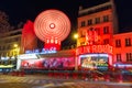 Cabaret Moulin Rouge at night in Paris, France