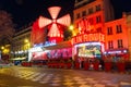 Cabaret Moulin Rouge at night in Paris, France