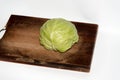 Cabbage on the chopping borad on white background