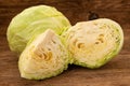 Cabbage and cut cabage on wooden board Royalty Free Stock Photo