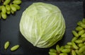 Cabbage grapes vegatarian health fruit vegetables dark stone background Royalty Free Stock Photo