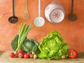 Cabbage, lettuce, kitchen utensils