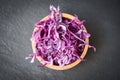 Cabbage purple / Shredded red cabbage slice in a wooden bowl and dark background