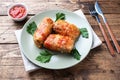 Cabbage rolls with beef, rice and vegetables on the plate. Stuffed cabbage leaves with meat. Wooden background