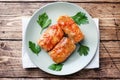 Cabbage rolls with beef, rice and vegetables on the plate. Stuffed cabbage leaves with meat. Wooden background Copy