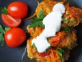 Cabbage rolls with meat, rice and vegetables. Stuffed Peking cabbage leaves with meat, in tomato sauce, on a black plate. Royalty Free Stock Photo