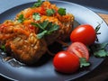 Cabbage rolls with meat, rice and vegetables. Stuffed Peking cabbage leaves with meat, in tomato sauce, on a black plate with Royalty Free Stock Photo