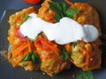 Cabbage rolls with meat, rice and vegetables. Stuffed Peking cabbage leaves with meat, in tomato sauce, on a black plate with Royalty Free Stock Photo