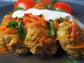 Cabbage rolls with meat, rice and vegetables. Stuffed Peking cabbage leaves with meat, in tomato sauce, on a black plate with Royalty Free Stock Photo