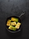 Cabbage rolls tied with string and served on a pan