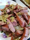 Cabbage and sausage with onions and peppers sauteed