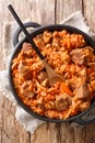 Cabbage stew with beef meat, tomatoes, carrots closeup in a plate. Vertical top view Royalty Free Stock Photo