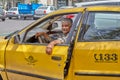 Cabdriver is resting in the car in cabstand, Kashan, Iran.