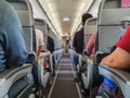 cabin of airplane with passengers on seats waiting to take off. Royalty Free Stock Photo