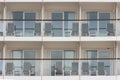 Cabin balconies of cruise liner and folding chairs at it