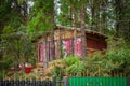 Cabin Built with Wooden Poles with Red Curtains Royalty Free Stock Photo