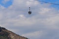Cabin of cable car against blue sky. Cableway in Tbilisi, Georgia