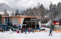 Cabin of cableway and skiers on slope at resort Hrabovo, Slovakia