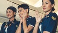 Cabin crew dancing with joy in airplane Royalty Free Stock Photo