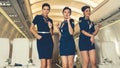 Cabin crew dancing with joy in airplane Royalty Free Stock Photo