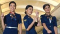 Cabin crew dancing with joy in airplane Royalty Free Stock Photo