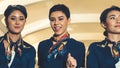 Cabin crew dancing with joy in airplane Royalty Free Stock Photo