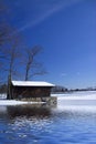 Cabin on frozen lake