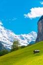 Cabin on green mountain slope. Swiss Alps landscape. Lauterbrunnen, Switzerland, Europe. Royalty Free Stock Photo