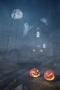 Cabin in a Halloween forest with pumpkin lanterns at night